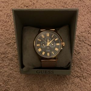 Gold and black guess watch